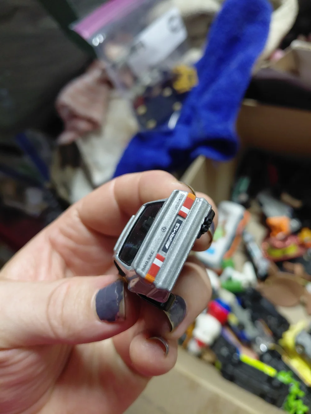 1:64 scale Hot Wheels '89 Mercedes-Benz 560 SEC AMG die-cast toy car.